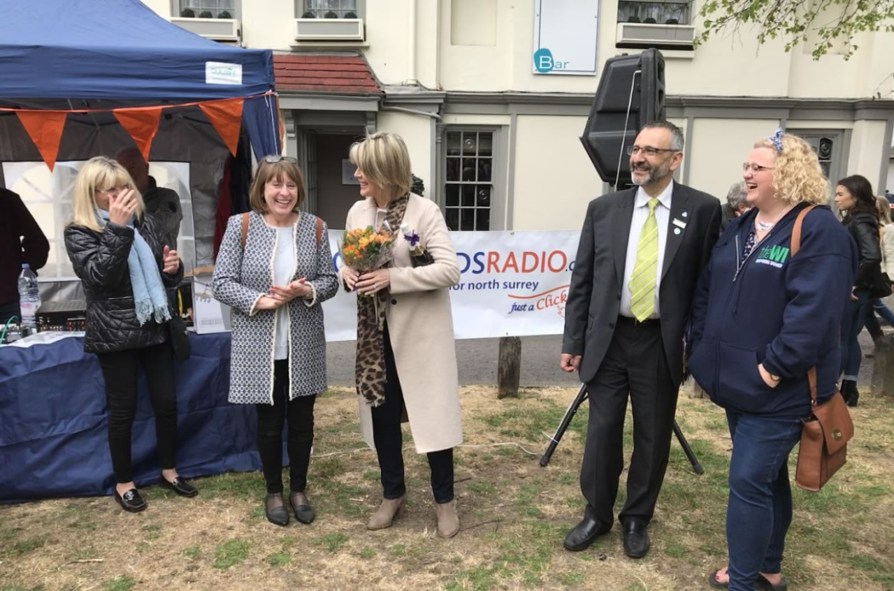 Gill Eastwood - Great Weybridge Cake Off Organiser sharing a joke with the team and judges including TV Celebrity Ruth Langsford