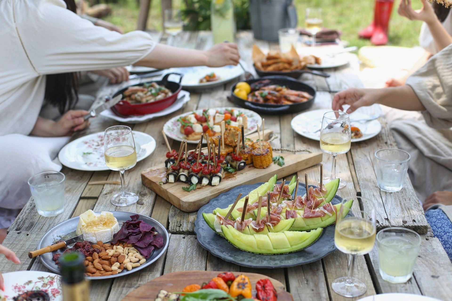 Friends eating meal together outdoors