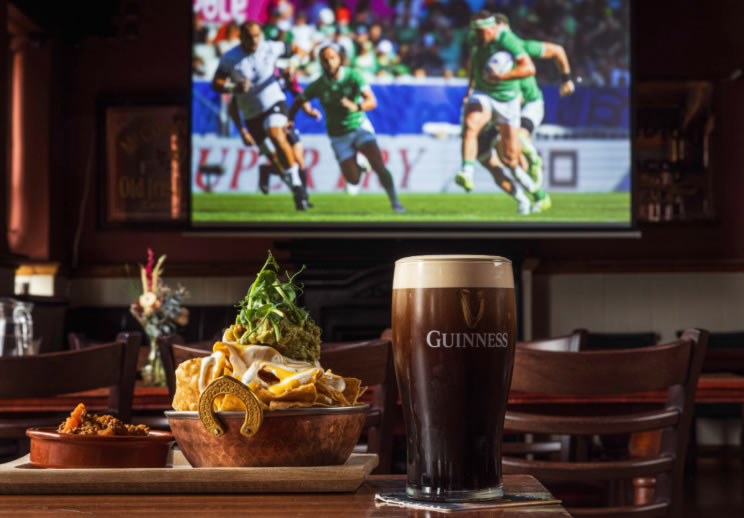 Irish Community enjoying Guinness and Rugby at Pub