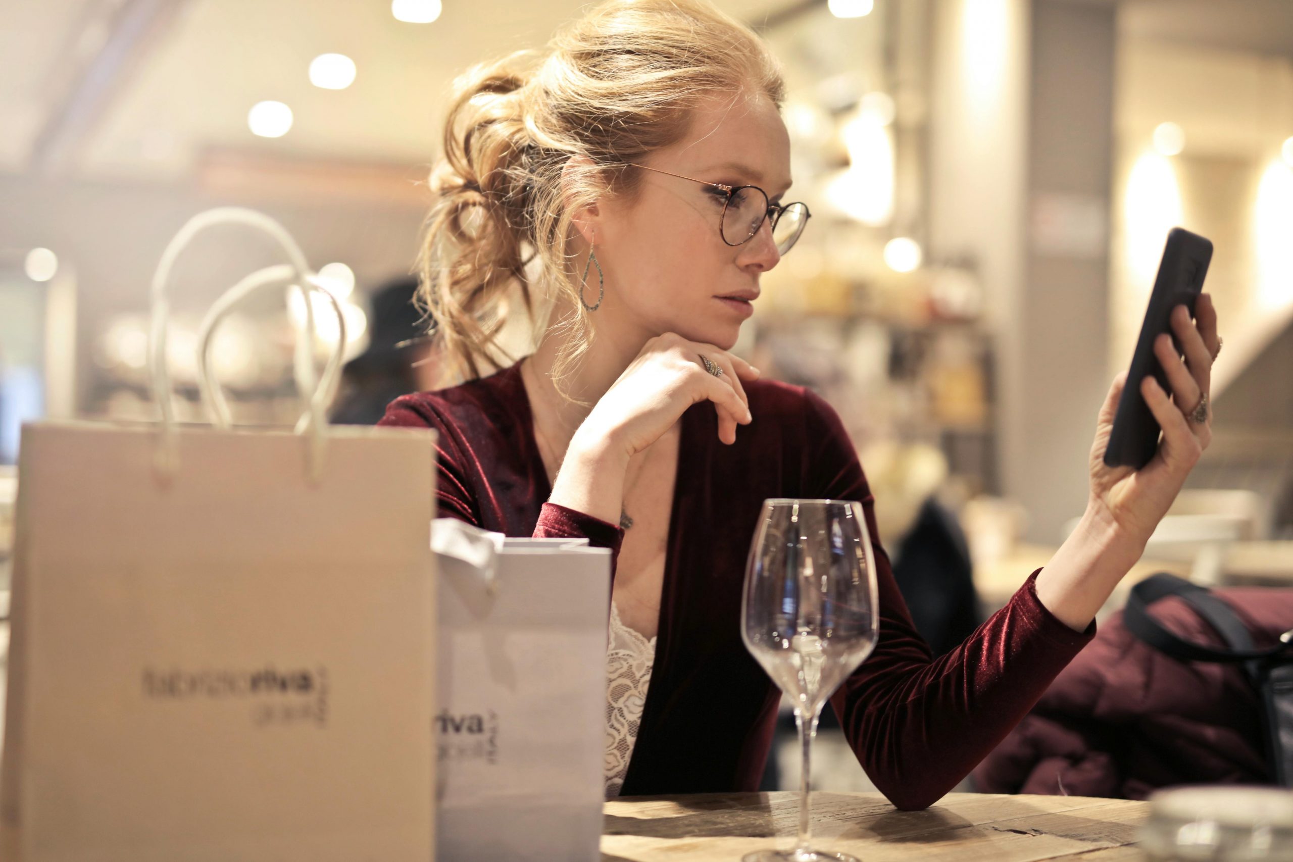 Looking at Phone - Shops Search - pexels-olly-99484