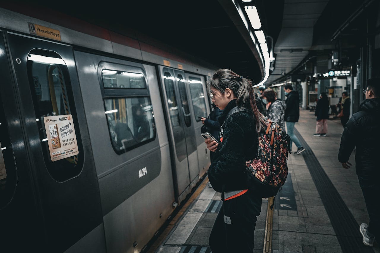 commuters getting on train