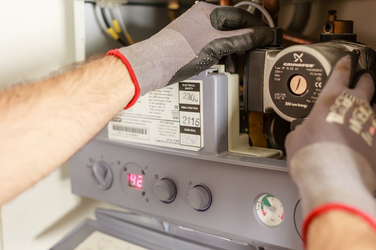 A plumber checking a home boiler